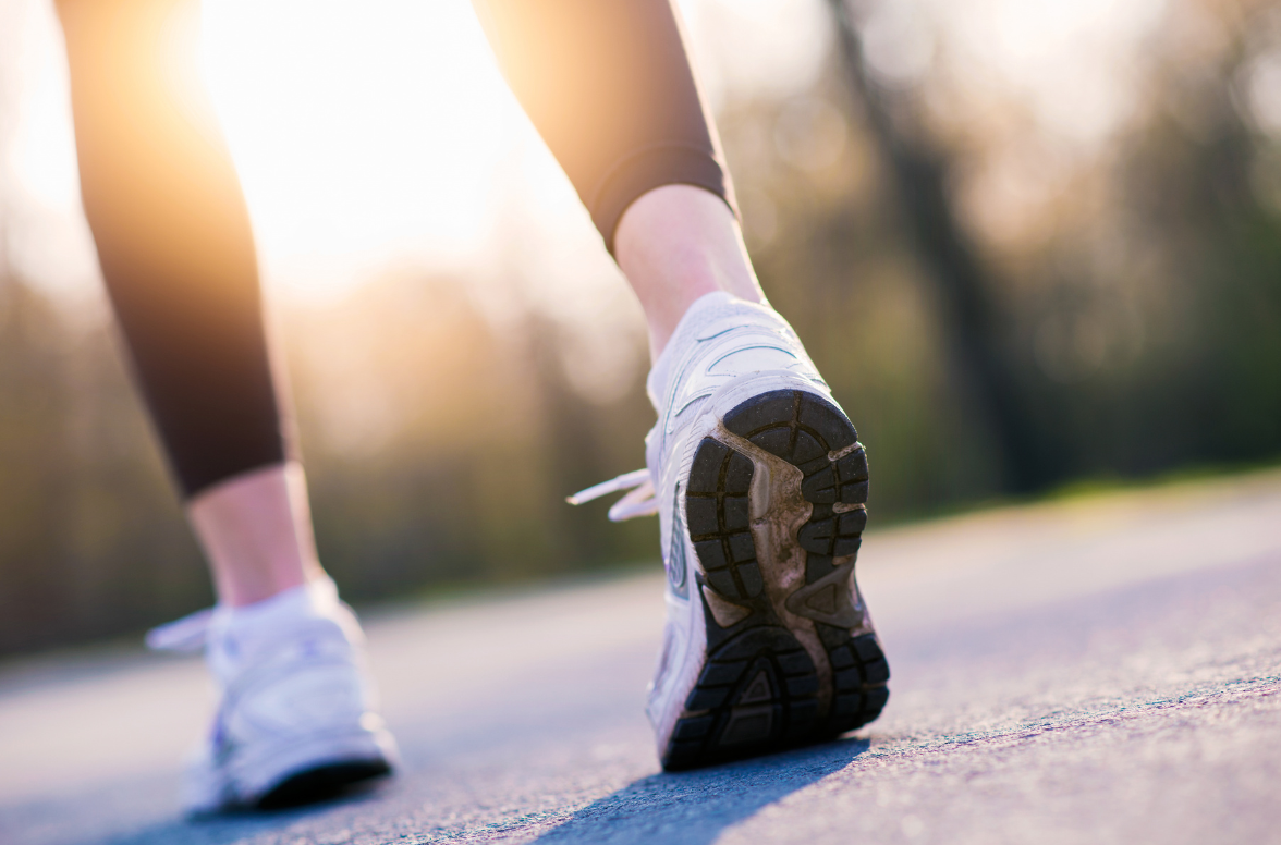 A person with chronic inflammation is walking down a path outside
